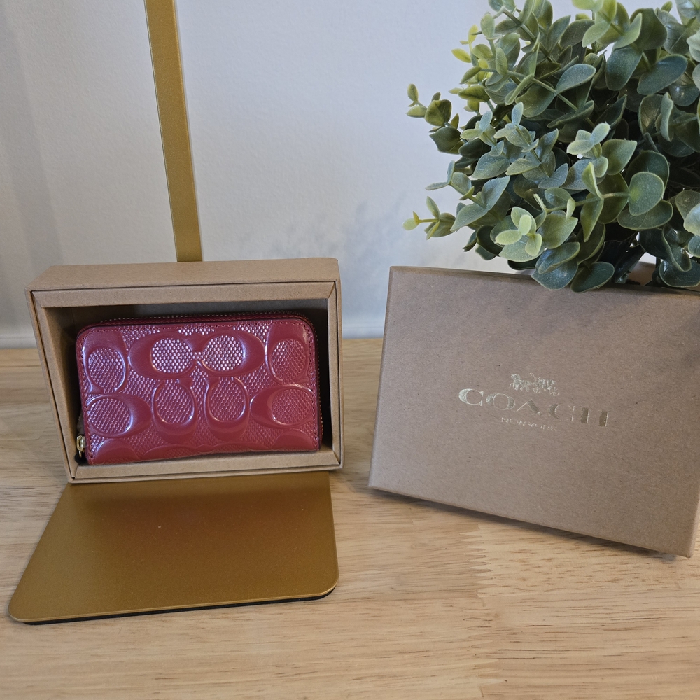 Coach Boxed Small Signature Patent Leather Zip Around Wallet.